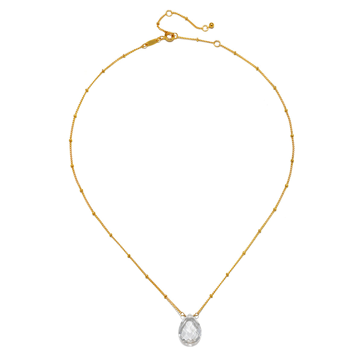 Enveloped in Protection Crystal Necklace featuring a stunning faceted teardrop of crystal quartz on an 18kt gold plated chain. This spiritual jewelry piece is perfect for meditation and serves as a talisman for protection, embodying meaning and significance for practitioners of yoga and manifestation. Ideal as part of a layered look, it resonates with the energies of the sun and moon, enhancing your spiritual journey and connection.