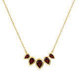 Ignite Strength Garnet Petal Necklace featuring five garnet lotus petals set in 18kt gold plate, a beautiful piece of spiritual jewelry symbolizing grounding energy and transformation, perfect for meditation and manifestation.