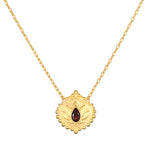 Grounded in Strength Garnet Lotus Necklace featuring a delicate 18kt gold plate pendant with a finely etched lotus and a faceted garnet, symbolizing new beginnings and strength; perfect for spiritual jewelry, meditation, and manifestation.