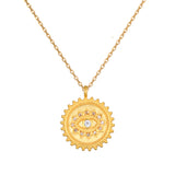 True Visionary White Topaz Evil Eye Coin Necklace featuring a gold-plated pendant with an eye motif, symbolizing protection and intuition, ideal for spiritual jewelry enthusiasts. Perfect for meditation, this meaningful talisman embodies manifestation qualities and is a beautiful addition to any yoga practice.