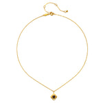 Spiritual Strength Garnet Lotus Necklace displayed on a flat surface, highlighting its delicate gold chain and beautiful pendant, ideal for anyone interested in spiritual, meaningful jewelry for yoga and talismanic properties.