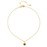 Spiritual Strength Garnet Lotus Necklace displayed on a flat surface, highlighting its delicate gold chain and beautiful pendant, ideal for anyone interested in spiritual, meaningful jewelry for yoga and talismanic properties.