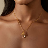 A close-up view of the Manifest Rebirth White Topaz Snake Necklace worn, highlighting its elegant design and clarity of the white topaz, ideal for those seeking spiritual and meaningful talismans for protection and manifestation.