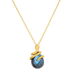 Inner Knowing Labradorite Snake Necklace crafted with a delicate 18kt gold plate chain, featuring a coiled snake design cradling a stunning labradorite stone, symbolizing intuition and transformation. Perfect spiritual jewelry for meditation and as a meaningful talisman for protection and manifestation.