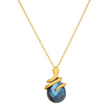 Inner Knowing Labradorite Snake Necklace crafted with a delicate 18kt gold plate chain, featuring a coiled snake design cradling a stunning labradorite stone, symbolizing intuition and transformation. Perfect spiritual jewelry for meditation and as a meaningful talisman for protection and manifestation.