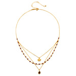 Embrace Change Garnet Lotus Triple Necklace, crafted with an 18kt gold plate and stunning garnet beads, represents transformation and grounding energy, perfect for spiritual jewelry associated with meditation, talismans, zodiac signs, and meaningful manifestations in yoga practices.