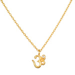 Universal Connection White Topaz Om Necklace, featuring an elegant Om symbol in 18kt gold plate, perfect for spiritual jewelry and meditation. This meaningful piece is a talisman of manifestation, blending the energies of the sun and moon, ideal for yoga enthusiasts seeking protection and clarity.