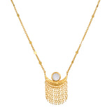 A Cascade of Starlight Moonstone Fringe Necklace featuring an 18kt gold plated crescent moon design with a faceted round moonstone. This spiritual jewelry is perfect for meditation and serves as a talisman for protection and manifestation, blending the energies of the sun, moon, and zodiac.