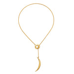 The Dreams Celestial Sun and Moon Lariat Necklace displayed elegantly against a simple background. This spiritual piece, featuring the sun and moon, embodies protection and is ideal for those interested in meaningful jewelry related to meditation, talismans, and zodiac energy.