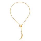 The Dreams Celestial Sun and Moon Lariat Necklace displayed elegantly against a simple background. This spiritual piece, featuring the sun and moon, embodies protection and is ideal for those interested in meaningful jewelry related to meditation, talismans, and zodiac energy.