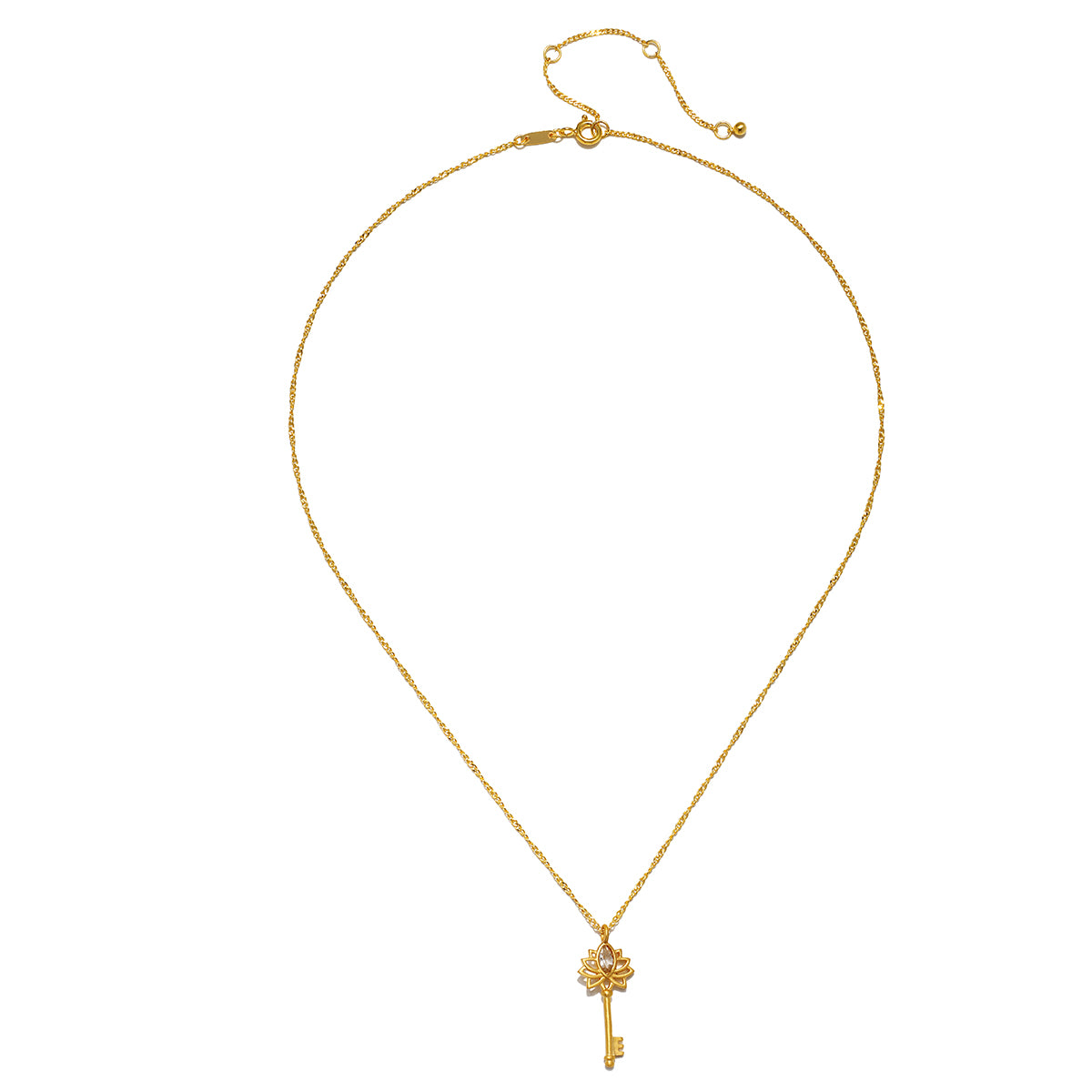 The Key to My Heart White Topaz Key Necklace displayed elegantly, showcasing its gold-plated finish and lotus detail, a perfect piece of spiritual jewelry. This necklace represents empowerment and the transformative power of love, making it an ideal talisman for meditation and supporting manifestation in one's life.