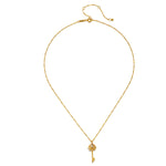 The Key to My Heart White Topaz Key Necklace displayed elegantly, showcasing its gold-plated finish and lotus detail, a perfect piece of spiritual jewelry. This necklace represents empowerment and the transformative power of love, making it an ideal talisman for meditation and supporting manifestation in one's life.