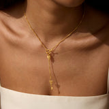 A close-up of the Promise to Love Heart Key Lariat Necklace worn on a woman's neck, showcasing its elegant design and spiritual symbolism, embodying love and manifestation, perfect for meditation and as a talisman for protection during yoga and mindfulness practices.