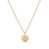 Journey to Love Moonstone Lotus Heart Necklace featuring a heart-shaped moonstone pendant surrounded by delicate lotus petals. This spiritual jewelry piece symbolizes love and transformation, perfect for meditation and as a talisman. Ideal for those practicing yoga or seeking meaningful representation of their zodiac and spiritual journey, this necklace embodies protection and the essence of manifestation.