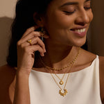 Model showcasing the Journey to Love Rose Quartz Lotus Heart Ring alongside other jewelry pieces, capturing a moment of joy and spirituality. This meaningful ring represents love and transformation, aligning with themes of zodiac and meditation.