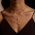 A woman showcasing the Blooming Love Lotus Petal Necklace layered with other accessories, exemplifying the essence of spiritual jewelry and meditation. This elegant necklace symbolizes transformation and renewal, perfect for those on a journey of personal growth and manifestation.