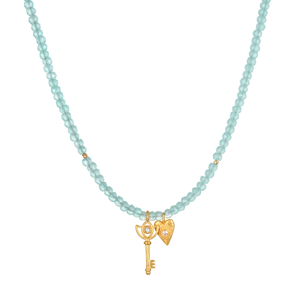 Love Unlocked Chalcedony Beaded Key Heart Necklace showcasing a delicate design with chalcedony beads, ideal for spiritual jewelry and meditation. This meaningful piece serves as a talisman for protection and manifestation, embodying the energy of the sun and moon, perfect for yoga enthusiasts.