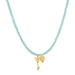 Love Unlocked Chalcedony Beaded Key Heart Necklace showcasing a delicate design with chalcedony beads, ideal for spiritual jewelry and meditation. This meaningful piece serves as a talisman for protection and manifestation, embodying the energy of the sun and moon, perfect for yoga enthusiasts.
