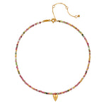 Close-up of the Aligned with Love Pink Tourmaline Heart Choker Necklace showcasing its vibrant gemstones, symbolizing spirituality, and serving as a beautiful talisman for meaningful intentions in your journey.