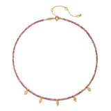 Transformed by Healing Rhodonite Lotus Petal Choker Necklace featuring elegant rhodonite beads and gold-plated lotus petal charms. This spiritual jewelry symbolizes transformation and renewal, making it a perfect talisman for meditation and manifestation. Ideal for yoga enthusiasts and those seeking meaning in their accessories, this piece resonates with the energies of the sun and moon, providing protection and fostering inner growth.