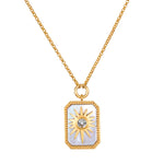 Gold chain necklace with rectangular mother of pearl pendant featuring a gold sun design and center crystal.