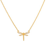 Gold-toned dragonfly pendant with white crystal accents on a delicate chain necklace.