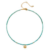 Turquoise beaded choker necklace with gold-tone sun pendant and adjustable chain closure.