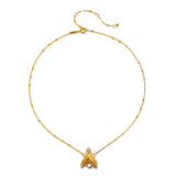 Gold-tone chain necklace with delicate beaded links and a faceted crystal pendant shaped like a firefly at the center.