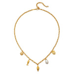 Gold chain necklace with shell, fish, sun, and pearl charms hanging from center.