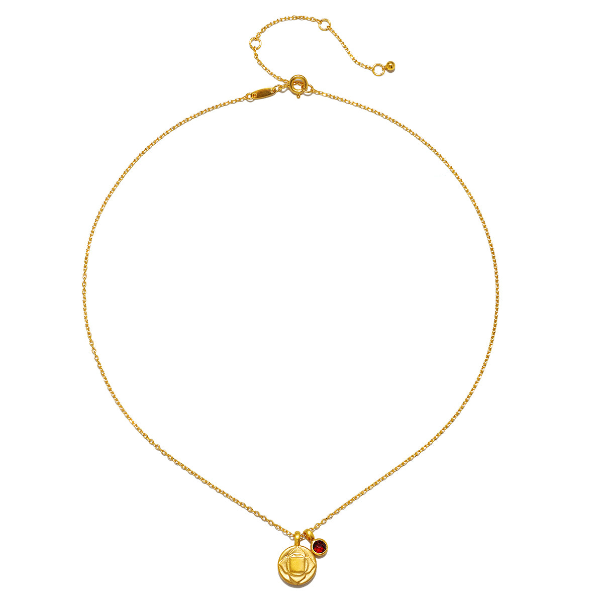 Gold-toned chain necklace with circular chakra pendant featuring engraved symbol and small red stone accent.