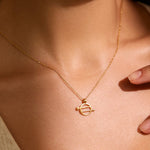 A close-up image of the Equal Means Equal necklace, featuring a gold pendant symbolizing gender equality. This spiritual jewelry serves as a meaningful amulet for meditation and yoga practices, encouraging manifestation and protection while promoting sacred values of justice and freedom.
