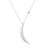 Close-up of the crescent moon necklace from the Inspiration Intention Necklace Set Silver, featuring a turquoise star pendant. This spiritual jewelry embodies the meaning of guidance and inner wisdom, perfect for those seeking encouragement in their yoga and meditation journeys.