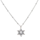 Guiding Faith Silver Star of David Necklace showcased elegantly, featuring a sparkling white topaz at its center. This spiritual jewelry serves as a talisman for protection and meditation, embodying the meaning of faith and connection to the universe. Perfect for yoga practitioners and those seeking meaningful adornments for manifestation.