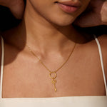 A model wearing the Unlock your Full Potential Lotus Key Charm necklace, showcasing its beauty and significance. This stylish spiritual jewelry symbolizes growth and self-discovery, ideal for yoga and meditation enthusiasts seeking protection and meaning in their journey.