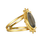 Pursue Your Truth Labradorite Ring captured from the side, showcasing its elegant design with a 21mm round faceted labradorite stone surrounded by gold accents. This spiritual jewelry is an ideal talisman for zodiac enthusiasts and those seeking protection and meaning on their journey of self-discovery and meditation.
