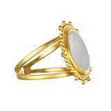 A side view of the Drift Into Daydreams Moonstone Ring, showing off its luminous moonstone and golden details, ideal for those interested in spiritual and zodiac-inspired adornments.