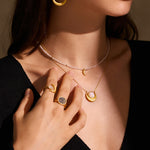 Model showcasing the Shine in Sisterhood Constellation Ring, highlighting its celestial design along with other jewelry pieces, perfect for those seeking spiritual meaning and connection with the sun and moon.