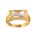 Eternal Radiance White Topaz Ring featuring a brilliant faceted white topaz on an 18kt gold plated band. This spiritual jewelry piece embodies individuality and creativity, perfect for meditation and as a talisman. Its design is meaningful for those seeking protection and alignment with the sun and moon energies, making it ideal for yoga practitioners and those focused on manifestation.