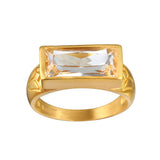 Eternal Radiance White Topaz Ring featuring a brilliant faceted white topaz on an 18kt gold plated band. This spiritual jewelry piece embodies individuality and creativity, perfect for meditation and as a talisman. Its design is meaningful for those seeking protection and alignment with the sun and moon energies, making it ideal for yoga practitioners and those focused on manifestation.