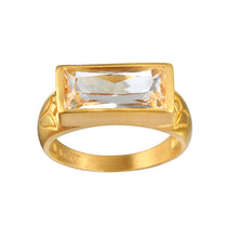 Eternal Radiance White Topaz Ring featuring a brilliant faceted white topaz on an 18kt gold plated band. This spiritual jewelry piece embodies individuality and creativity, perfect for meditation and as a talisman. Its design is meaningful for those seeking protection and alignment with the sun and moon energies, making it ideal for yoga practitioners and those focused on manifestation.