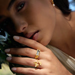 A stylish portrait of a model with the Blooming Splendor Lotus Green Amethyst Ring prominently on her finger, embodying elegance and spiritual clarity. This piece serves as a meaningful protector in her yoga practice and meditation.