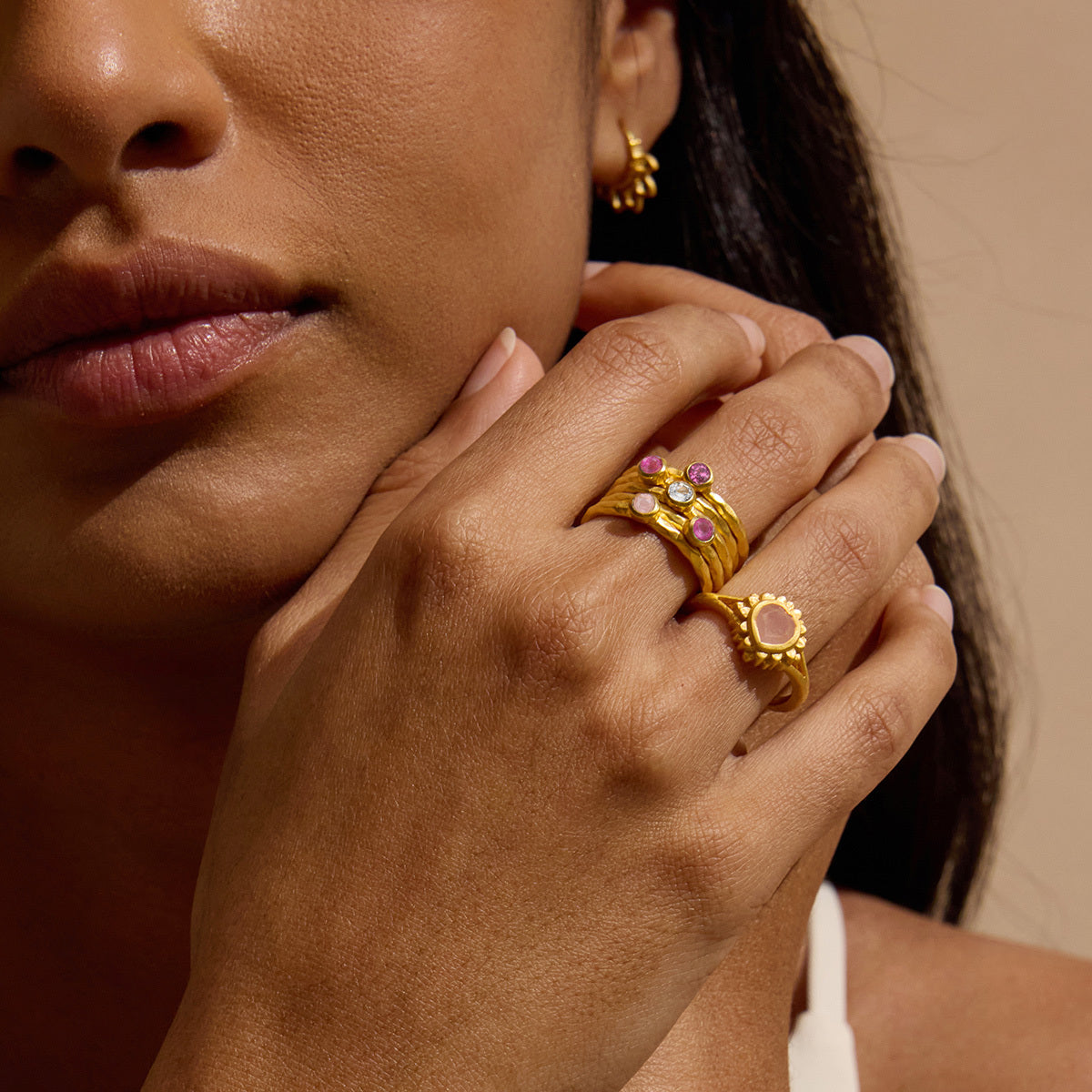 A close-up of a woman wearing the Guided by Love Gemstone Stacked Ring, featuring beautiful gemstones that symbolize love and intuition. This piece of spiritual jewelry acts as a talisman for manifestation and personal protection, perfect for meditation and yoga practices.