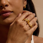 A close-up of a woman wearing the Guided by Love Gemstone Stacked Ring, featuring beautiful gemstones that symbolize love and intuition. This piece of spiritual jewelry acts as a talisman for manifestation and personal protection, perfect for meditation and yoga practices.