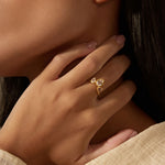 Close-up of a hand elegantly wearing the Manifesting Dreams White Topaz Petal Ring, symbolizing clarity and intuition, perfect for meditation practices and as a spiritual talisman for personal transformation and zodiac connections.