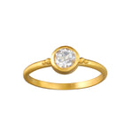 Second Sight White Topaz Ring featuring a bezel set white topaz gemstone atop an 18kt gold plate band, accented with delicate gold bead details. This beautiful piece embodies spiritual jewelry with its focus on clarity and manifestation, making it a perfect talisman for meditation practices and personal growth in yoga. It symbolizes the sun and moon's energies, infusing meaning and protection into its wearer's life.