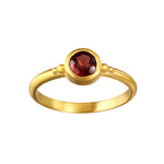 Inner Fire Garnet Ring featuring a bezel set red garnet on an 18kt gold plate band, representing grounding energy, love, and internal fire. Perfect for spiritual jewelry and meditation practices, its meaningful design serves as a talisman for manifestation.
