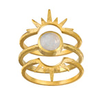 Close-up of the Light Seeker Moonstone Starburst Nested Ring Set featuring gold rings with a central moonstone, symbolizing spiritual jewelry and talismans for meditation and protection. The starburst design embraces themes of the sun and moon, representing meaningful connections to manifestation, yoga, and zodiac inspiration.
