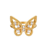 Gold butterfly ring with white topaz stones set in center and beaded edges on wings.