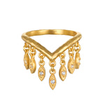 Gold V-shaped ring with dangling petal charms set with white topaz stones.