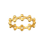 Gold band ring with interconnected spherical and cylindrical link design displayed against white background.